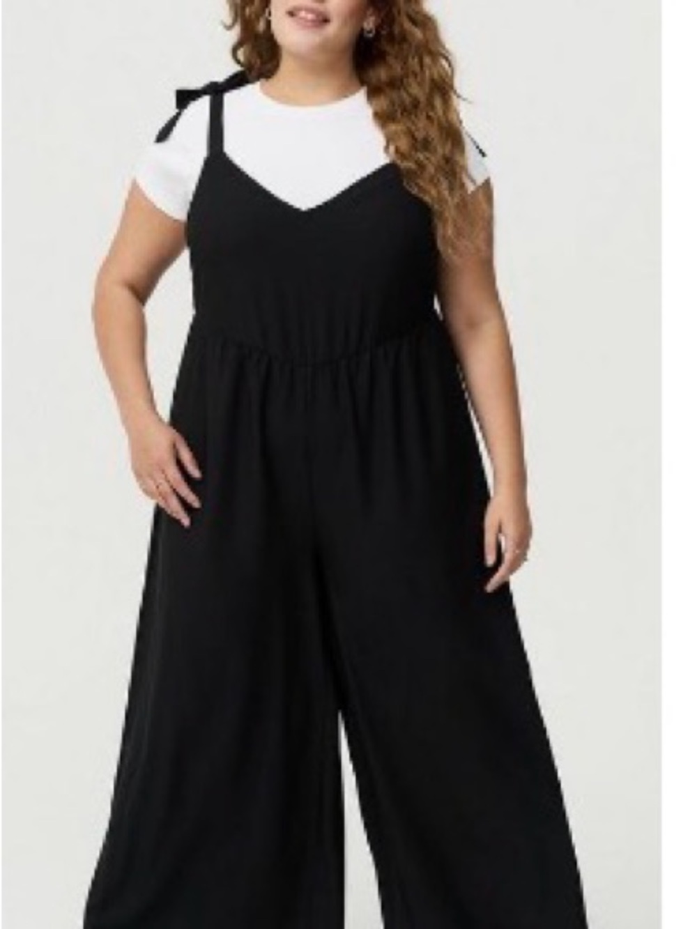2 Jumpsuits Black Wide-Leg Tie-Shoulder Jumpsuit and Blue jumpsuit.